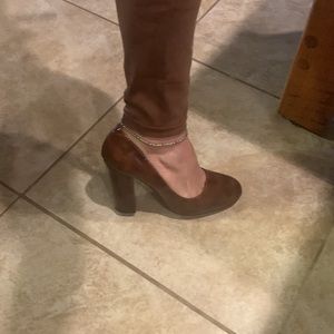 Mottled brown patent pumps